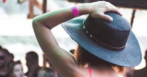 Person wearing a black cowboy hat